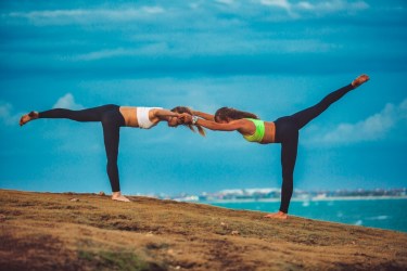 Partner yoga pose - Double Warrior III Pose