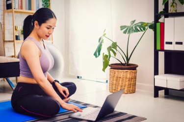 woman practicing morning yoga video